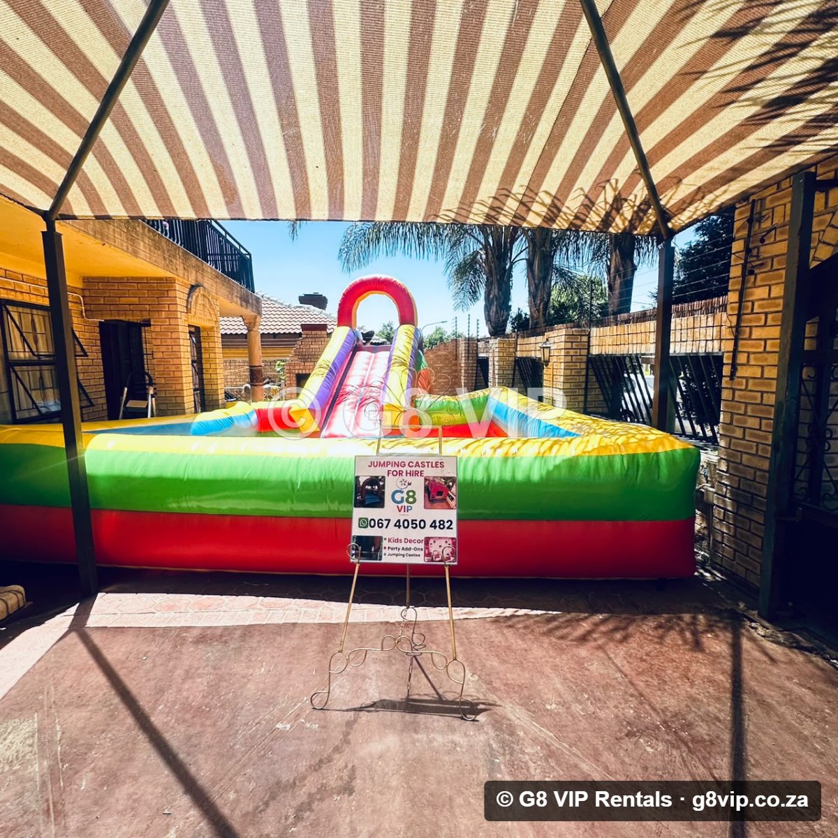 Slide & Pool Castle jumping castle with slide and pool - from the front
